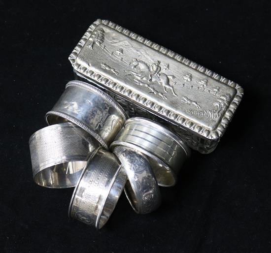 Silver napkin rings and silver topped box